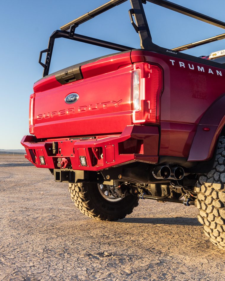Heavy duty rear bumper and lighting detail on a Truman Motors build
