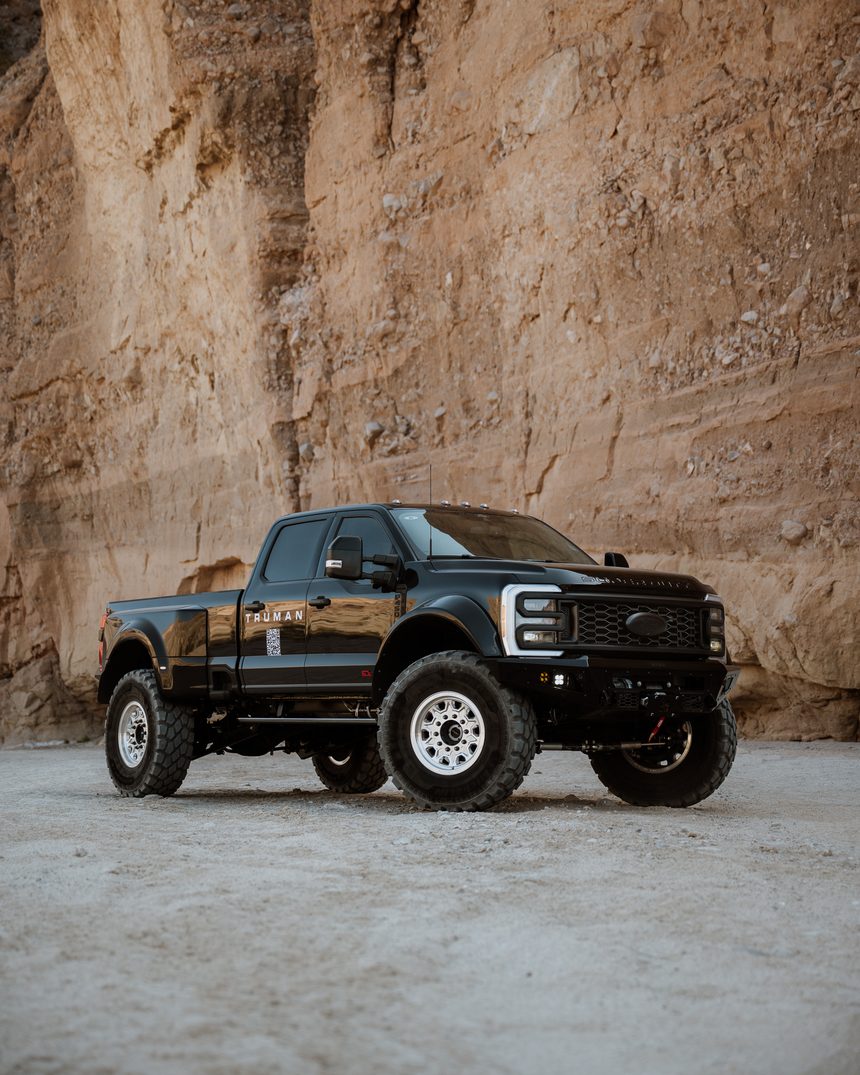 Blacked-out Truman F-450 against sandstone