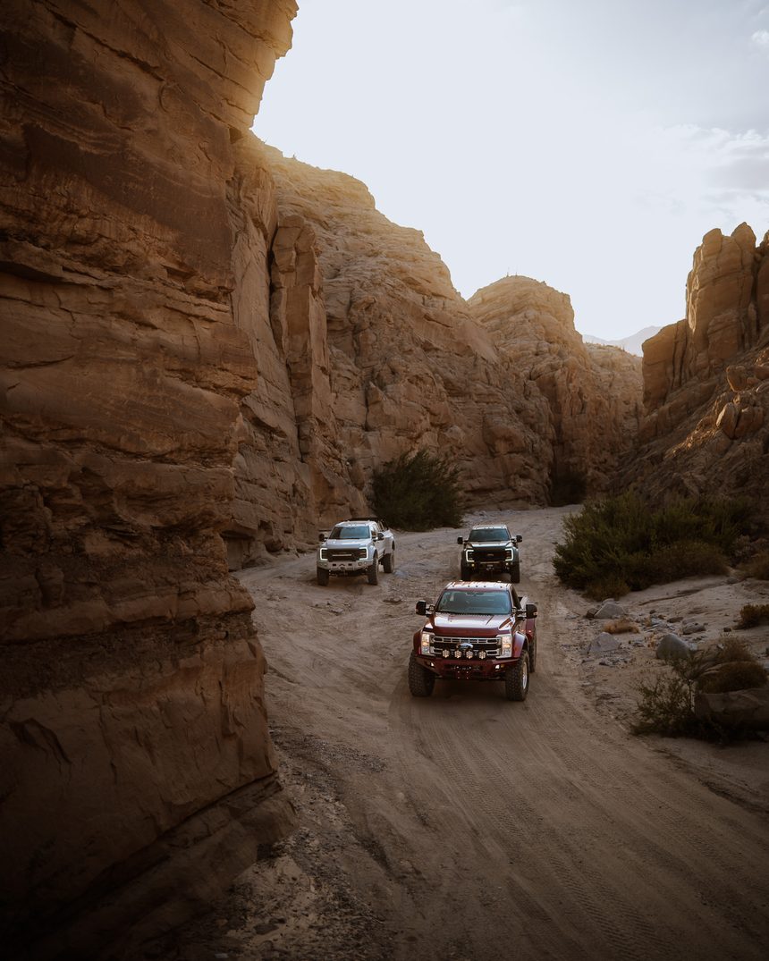 Two Truman Super Duty trucks in a slot canyon
