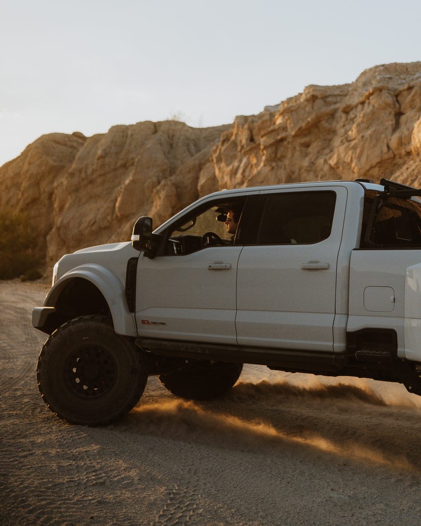 White Truman F-450 low angle in golden canyon light